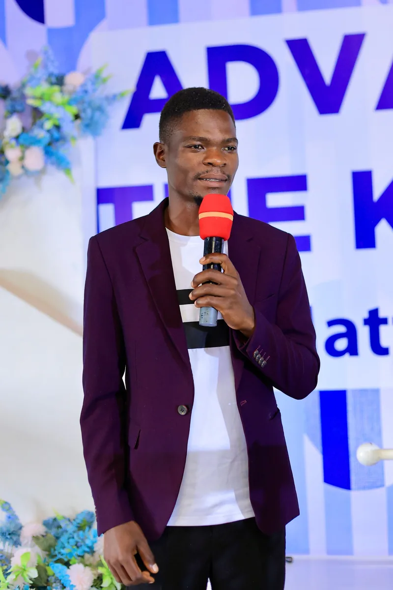 A young man speaking to the gathering