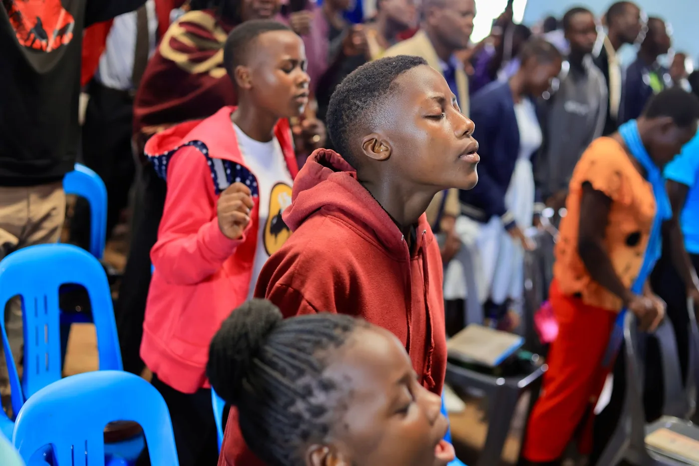 Young people worshipping during a gathering