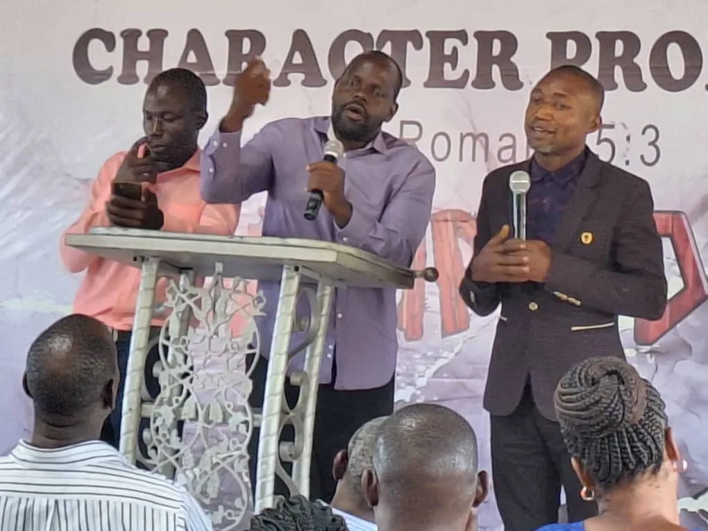 Two leaders teaching from the platform at the Character Production gathering